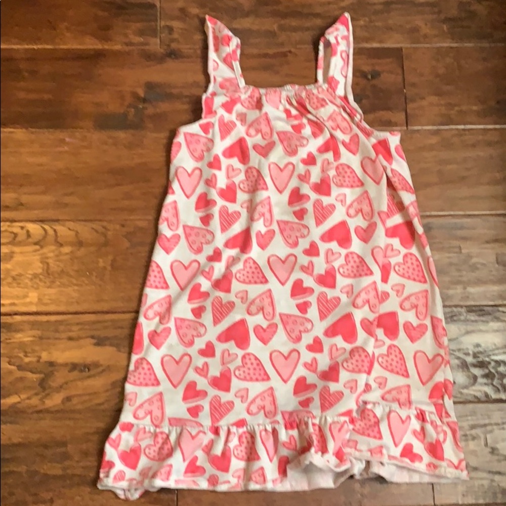 It is a cute sleep dress with a heart print